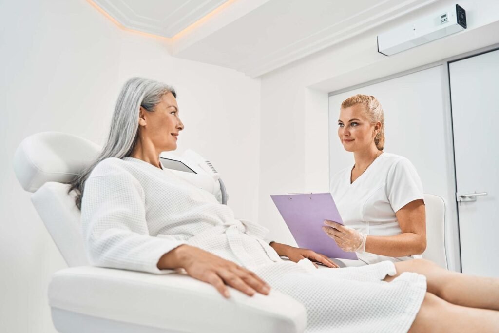 pleased blonde woman working in beauty clinic NW6FVAE 1 1 - Cocoona Plastic Surgery Dubai