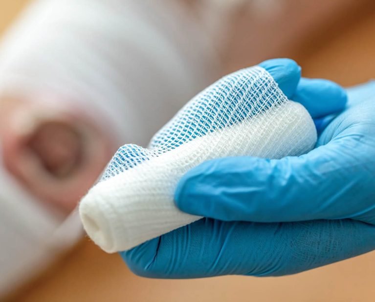 Wound care concept: Symbolizing change of dressing and cleaning of a wound with a realistic fake wound